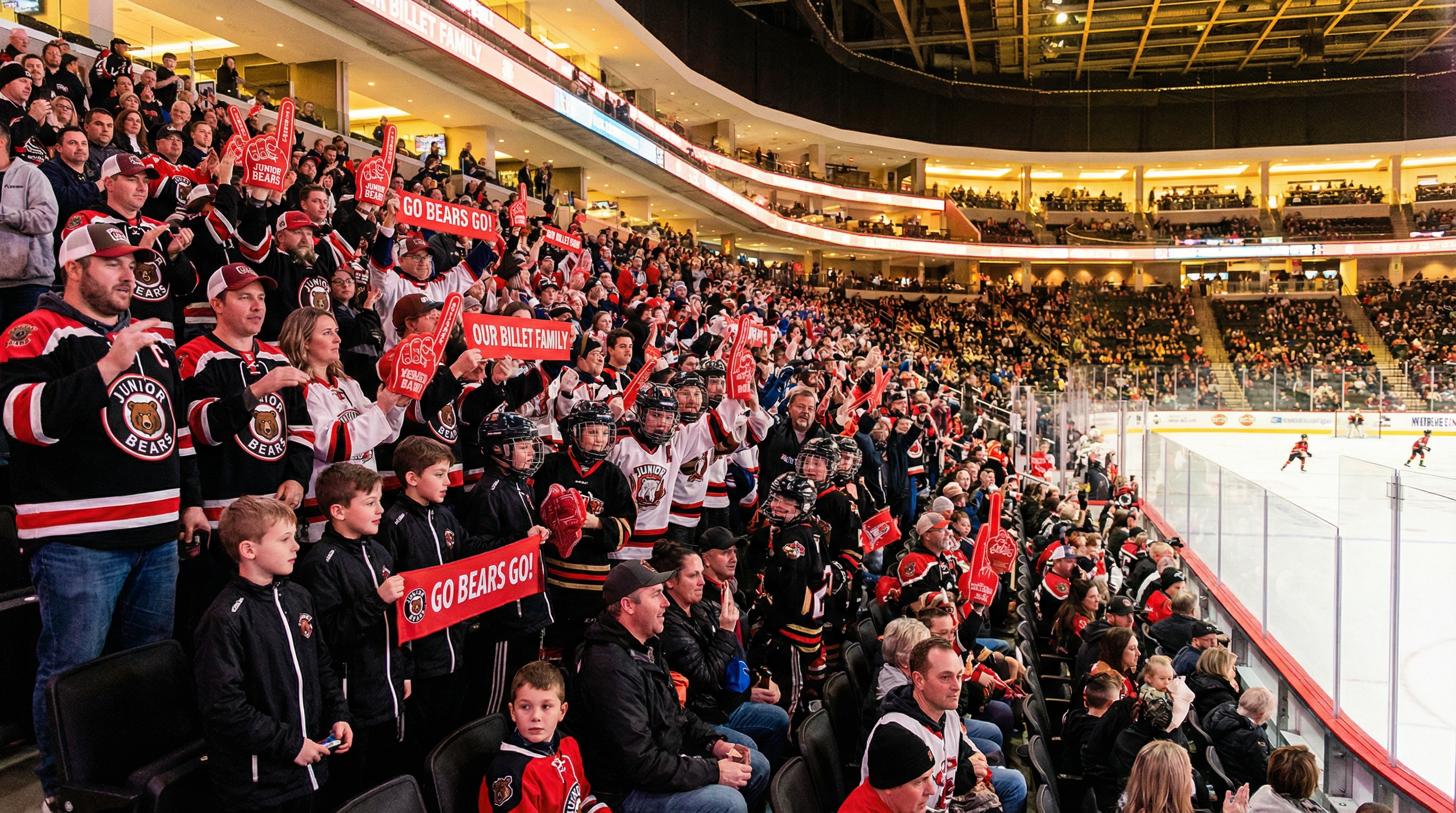 Billet families and fans cheering at a hockey game